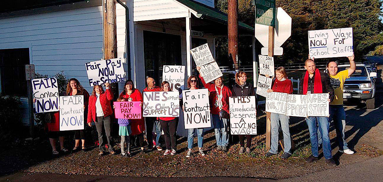 Some of the members of the Vashon Education Support Personnel union participating in an informational picket last week (TJ Moore Photo).