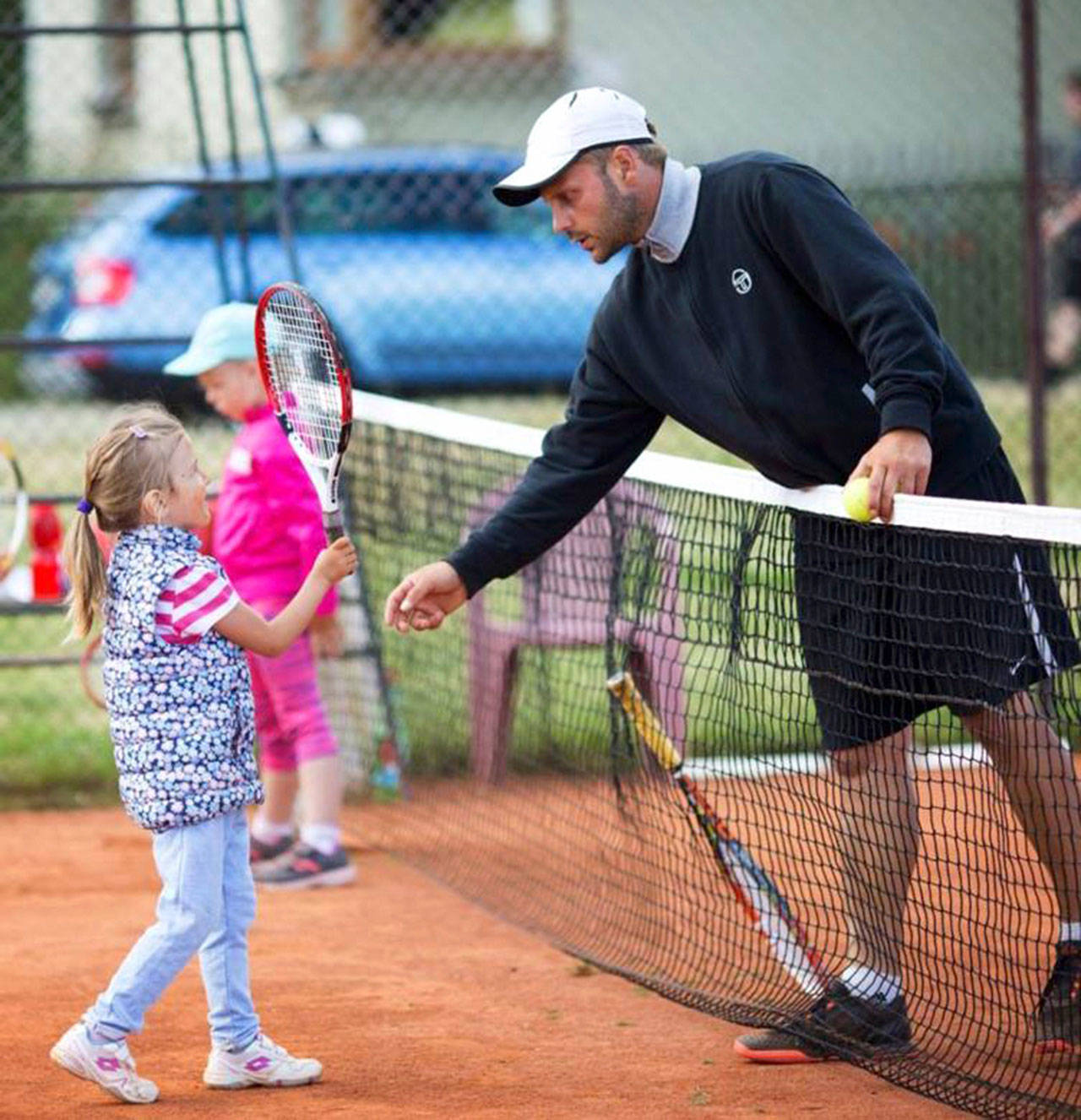Vashon Tennis Club instructor and Czech tennis coach, Jaroslav (Jerry) Honc, with a young player from the club’s 2017 summer camps (Courtesy photo).