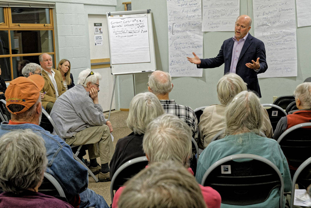 Neighborcare Health CEO Michael Erikson addresses those gathered for the meeting last week (Rick Wallace Photo).