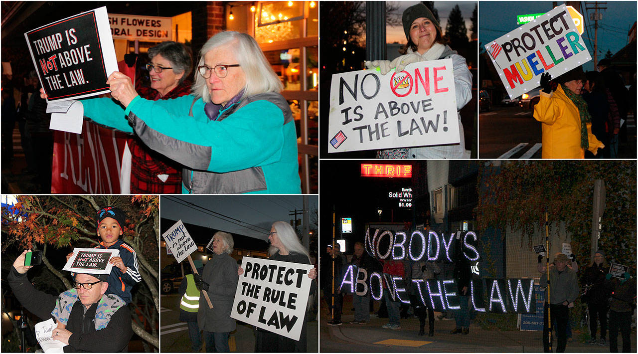 Approximately 70 islanders gathered at the four-way stop in downtown Vashon to protest President Trump’s appointment of acting-Attorney General Matt Whitaker (Paul Rowley/Staff Photos).