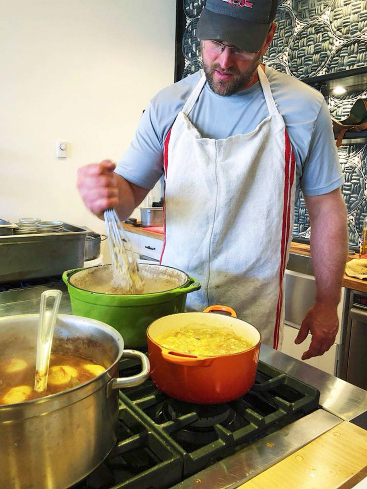 Pink Tractor Farm’s Dave Hatfield cooks a Palouse Winery dinner at Relish. (Shauna Ahern Photo)