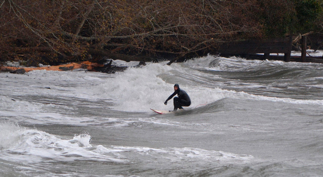 Winter storm brings breakers, and surfers, to the north end