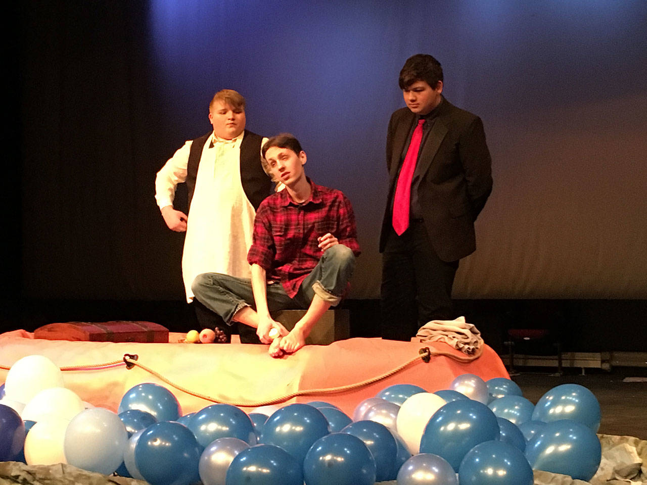 Courtesy Photo                                Joel Wiegner, Alex Guthery (seated), and Spencer Hartley, perform “Out at Sea” at Vashon High School.
