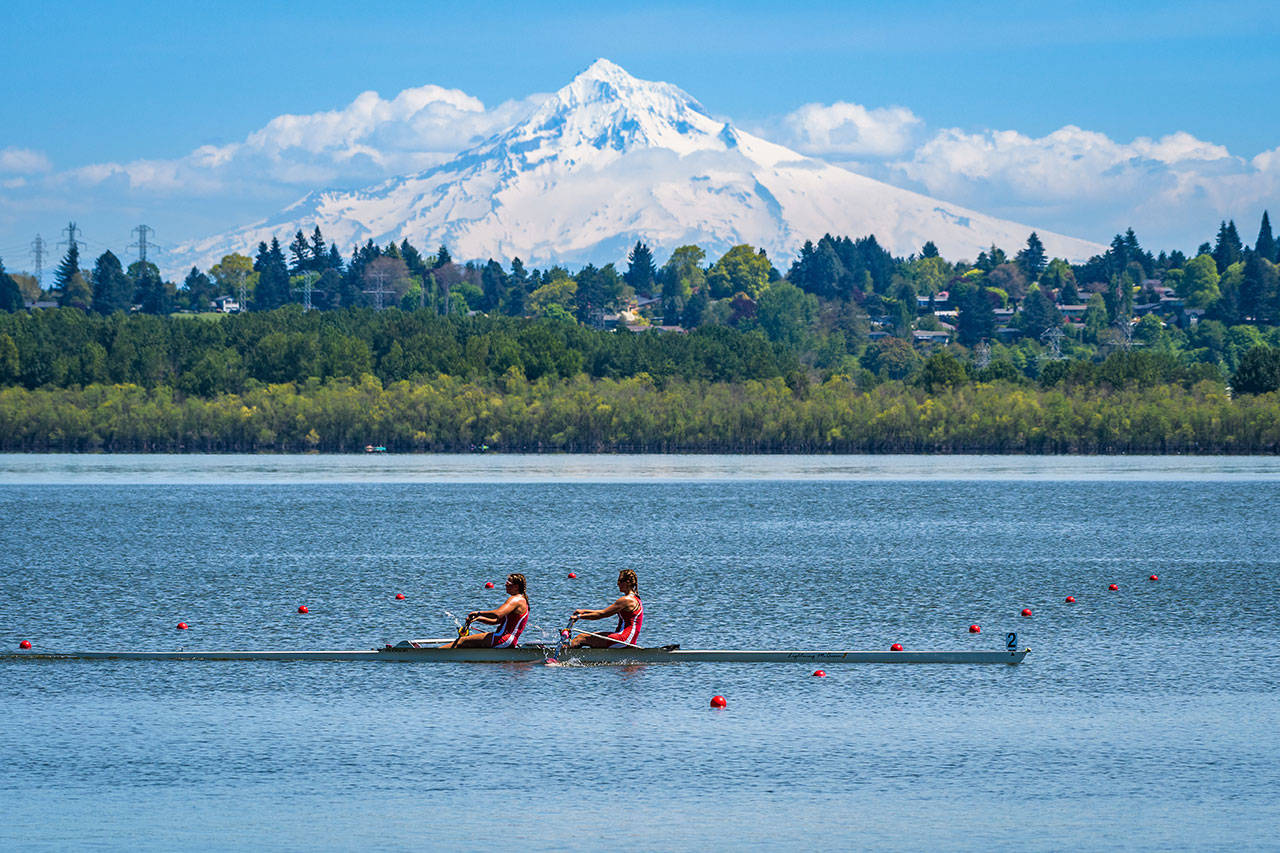 Burton Beach Rowing Club’s Gabbie Graves and Kate Kelly winning the women’s pair at Vancouver Lake on Sunday. Special guest appearance by Mount Hood (Steve Tosterud Photo).