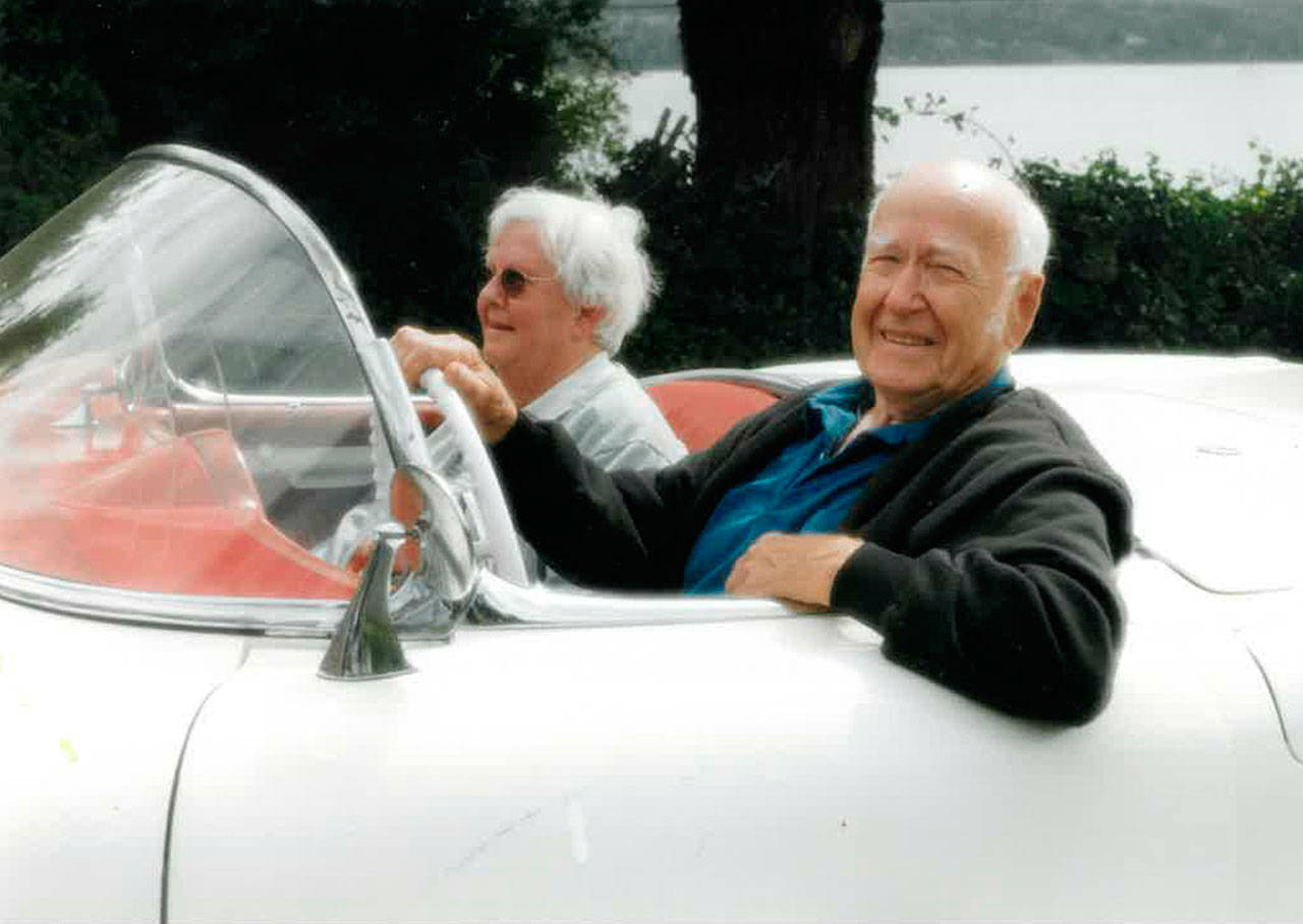 Gene Sherman, with his wife Peggy, drives his restored Corvette in 2001. (Sherman Family Photo)