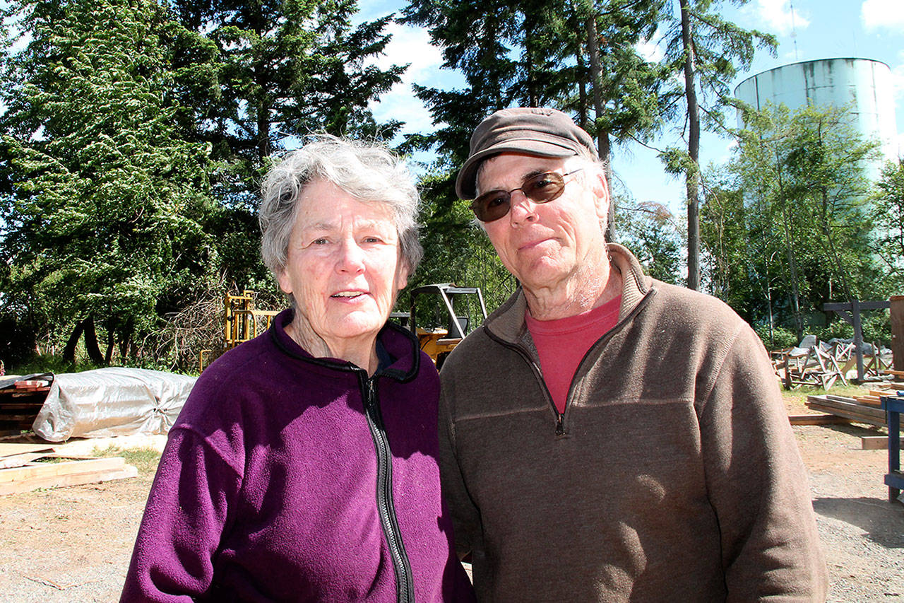 Resident and local activist Sheila Brown with VFS managing director David Warren. Brown stopped by for free sawdust for her composting toilet and to show her appreciation for the mill’s work (Peggy Chapman/Staff Photo).