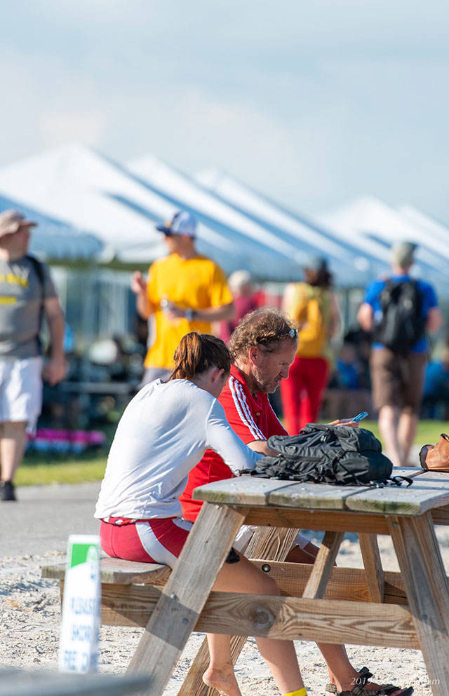 Mabel Moses conferring with coach Richard Parr at USRowing’s Youth National Championships in Sarasota, Florida, last weekend. (Jordan Petram Photo)