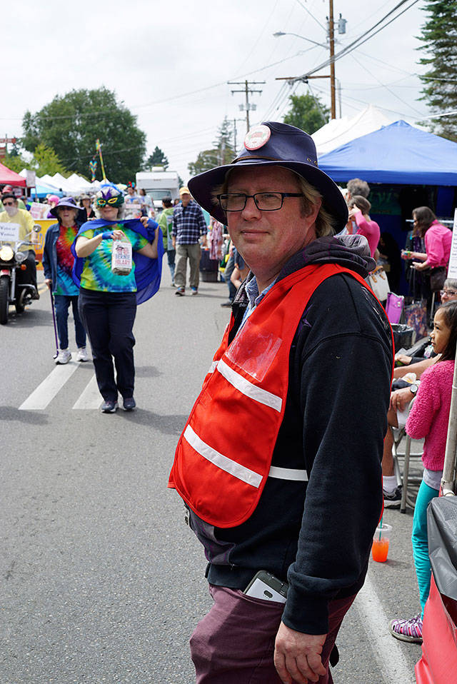 Jim Marsh, executive director of Vashon Island Chamber of Commerce, can often be spotted during the festival wearing a bright safety vest as he bicycles between events (Pete Welch Photo).