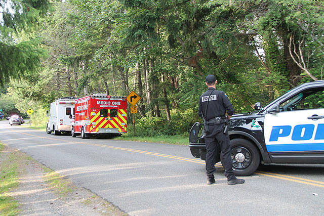 A large law enforcement presence arrived on the island Saturday, July 13, to help Tacoma police with a search warrant following Van Spronsens death and headed to the Westside Highway, where he lived in a bus on the Dolstad family property (Susan Riemer/Staff Photo).
