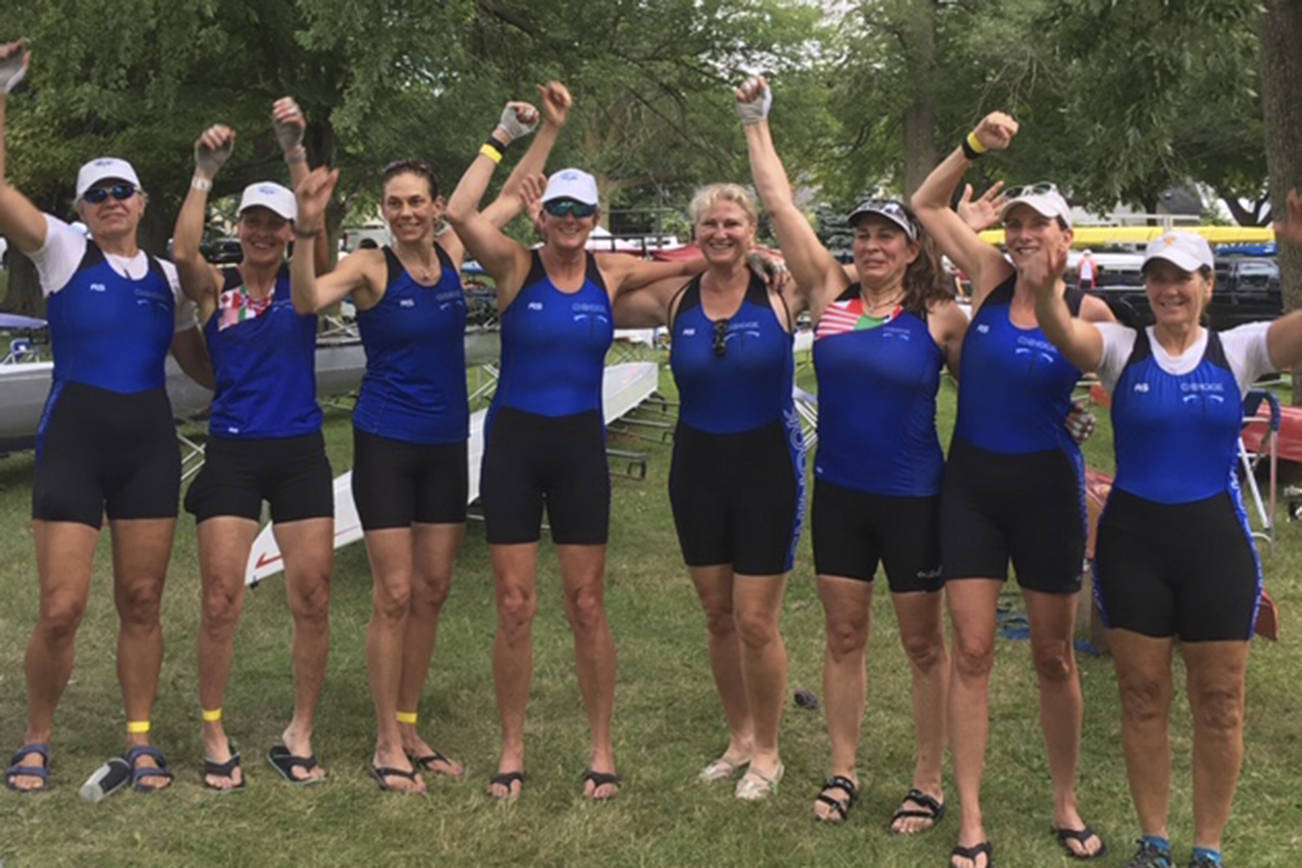 Courtesy Photo                                Vashon Island Rowing Club’s Kim Goforth (far left) celebrates a gold-medal finish with her team from Chinook Performance Racing at the Masters National Championship. Former Olympian Angie Schneider is fourth from the right.