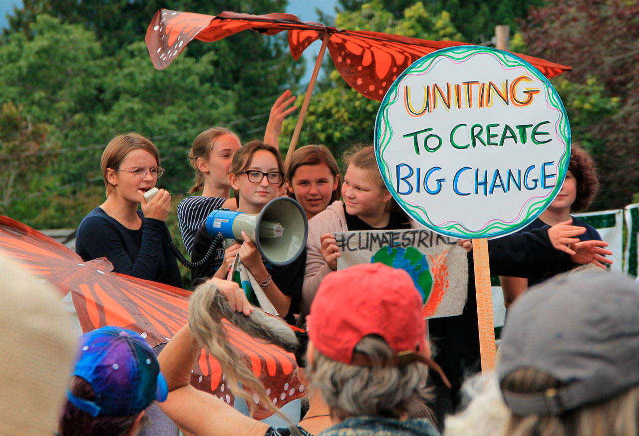 In the Village Green, where the island strike culminated, students gave remarks about their hope for a future spent living on a healthy planet (Paul Rowley/Staff Photo).