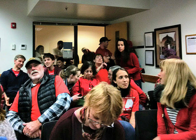 Many who attended last week’s school board meeting were dressed in red to show solidarity with other public school teachers nationwide (Paul Rowley/Staff Photo).