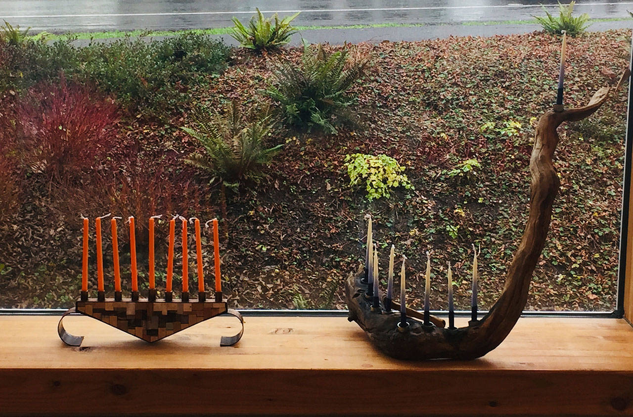 Two of 27 menorahs on display — an installation islander Risa Stahl called a “menorah flash mob” — graced Vashon Center for the Arts’ lobby in December. (Courtesy photo)