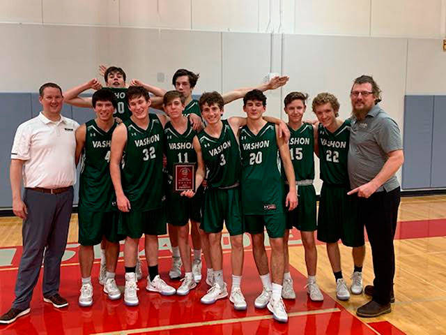 The VHS Boys Basketball team and coaches pose together after winning the Cascade Holiday Hoop Classic Dec. 27 and 28 in Leavenworth (Courtesy Photo).
