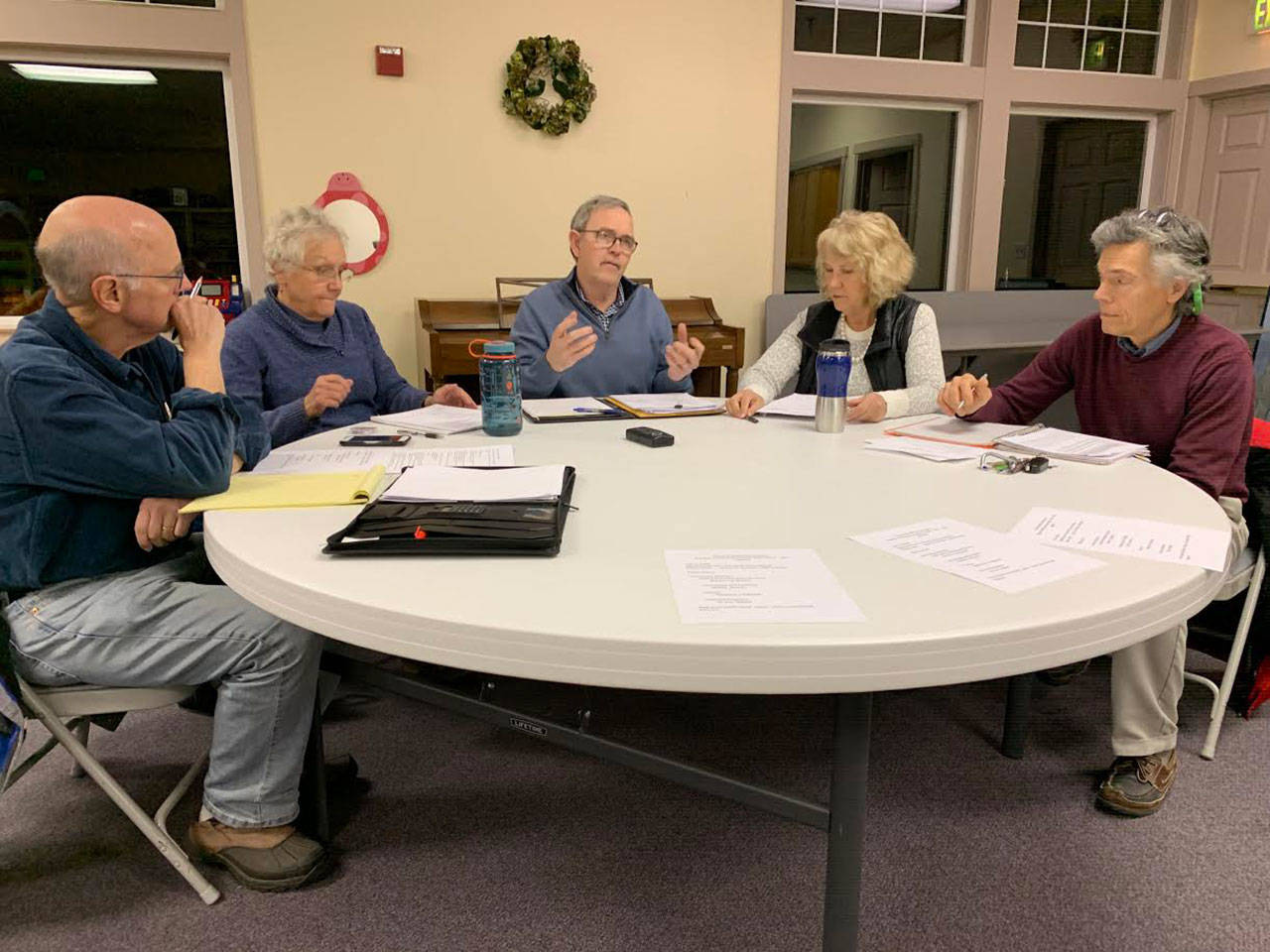 Vashon Health Care District Board of Commissioners (left to right): Eric Pyrne, Wendy Noble, Tom Langland, LeeAnn Brown and Don Wolczko meet at the Presbyterian Church on Jan. 8. (Kevin Opsahl/Staff Photo)