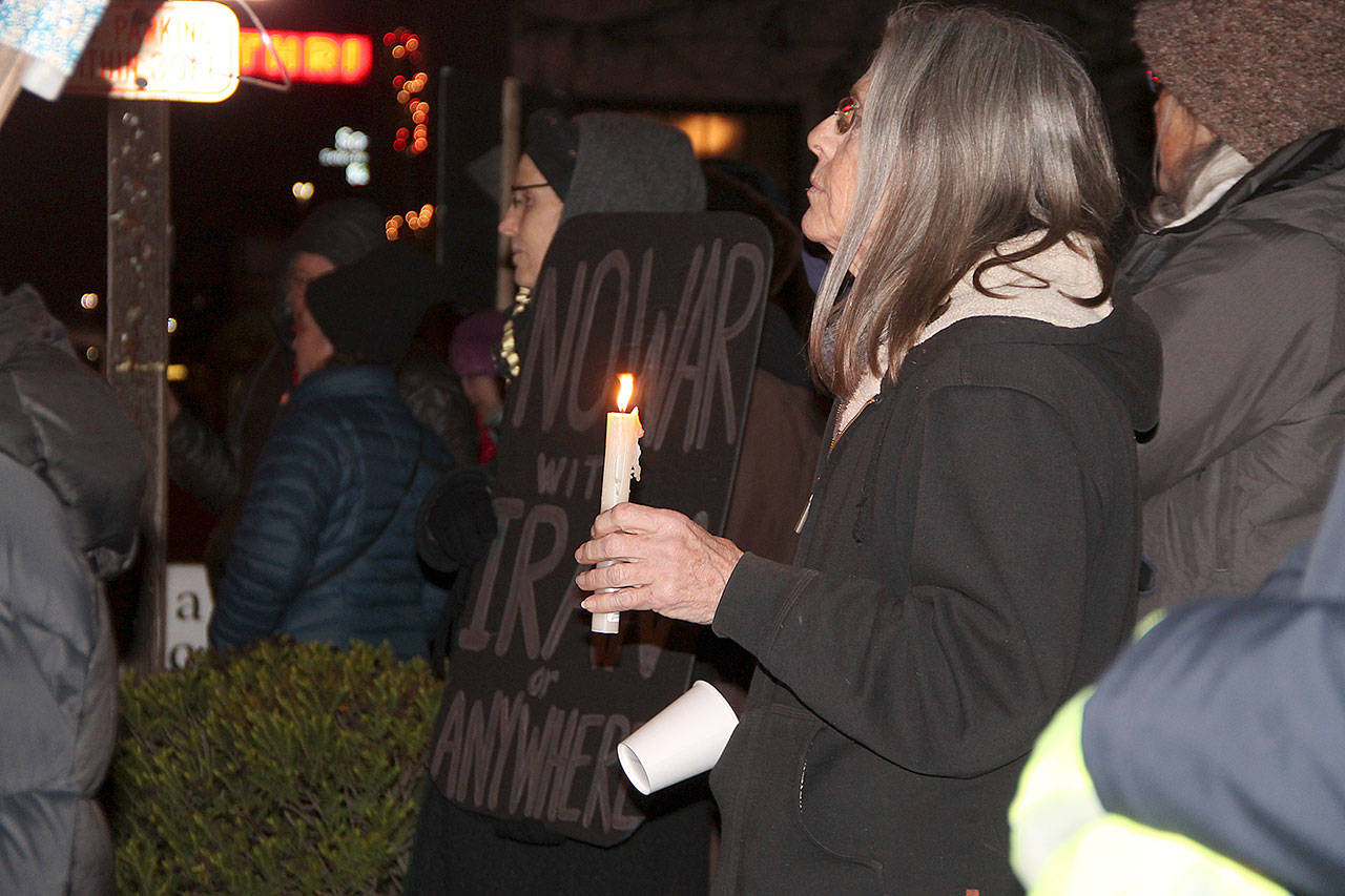 Islander Lin Noah joined others at a protest last week at the four-way stop (Paul Rowley/Staff Photo).