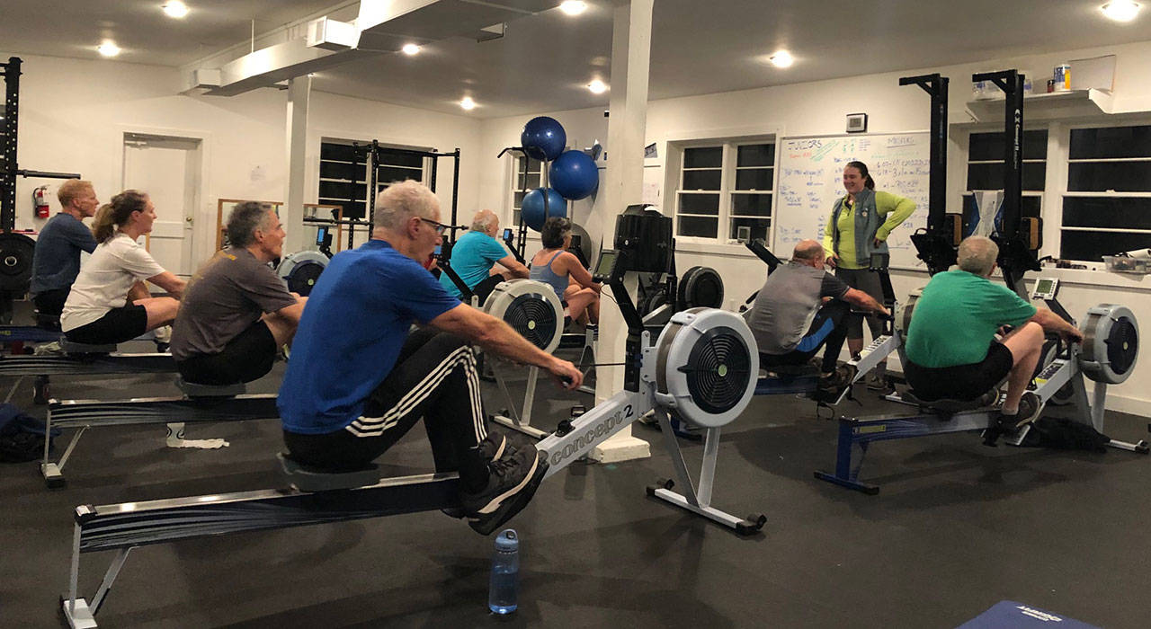 Masters rowers of the VIRC take their conditioning inside at the Vashon Island Rowing Club Indoor Facility at Sunrise Ridge on Jan. 16. (Kate Dowling/Staff Photo)