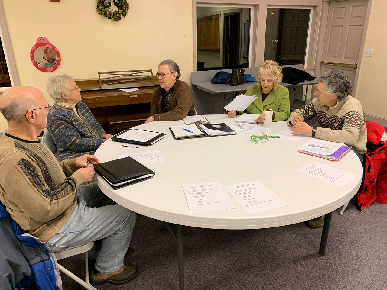 Vashon Health Care District board of commissioners (left to right): Eric Pryne, Wendy Noble, Tom Langland, LeeAnn Brown and Wolczko met at the Vashon Presbyterian Church on Jan. 15 (Kevin Opsahl/Staff Photo).