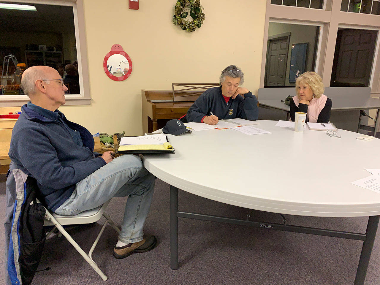 Vashon Health Care District commissioners Eric Pryne, Don Wolczko and LeeAnn Brown met Wednesday, Jan. 22, at the Vashon Presbyterian Church. (Kevin Opsahl/Staff Photo)