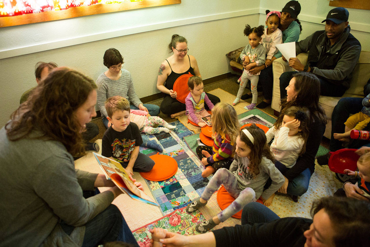 Children and parents are read a story at Family Place on Martin Luther King Jr. Day (Emma Cassidy Photo).