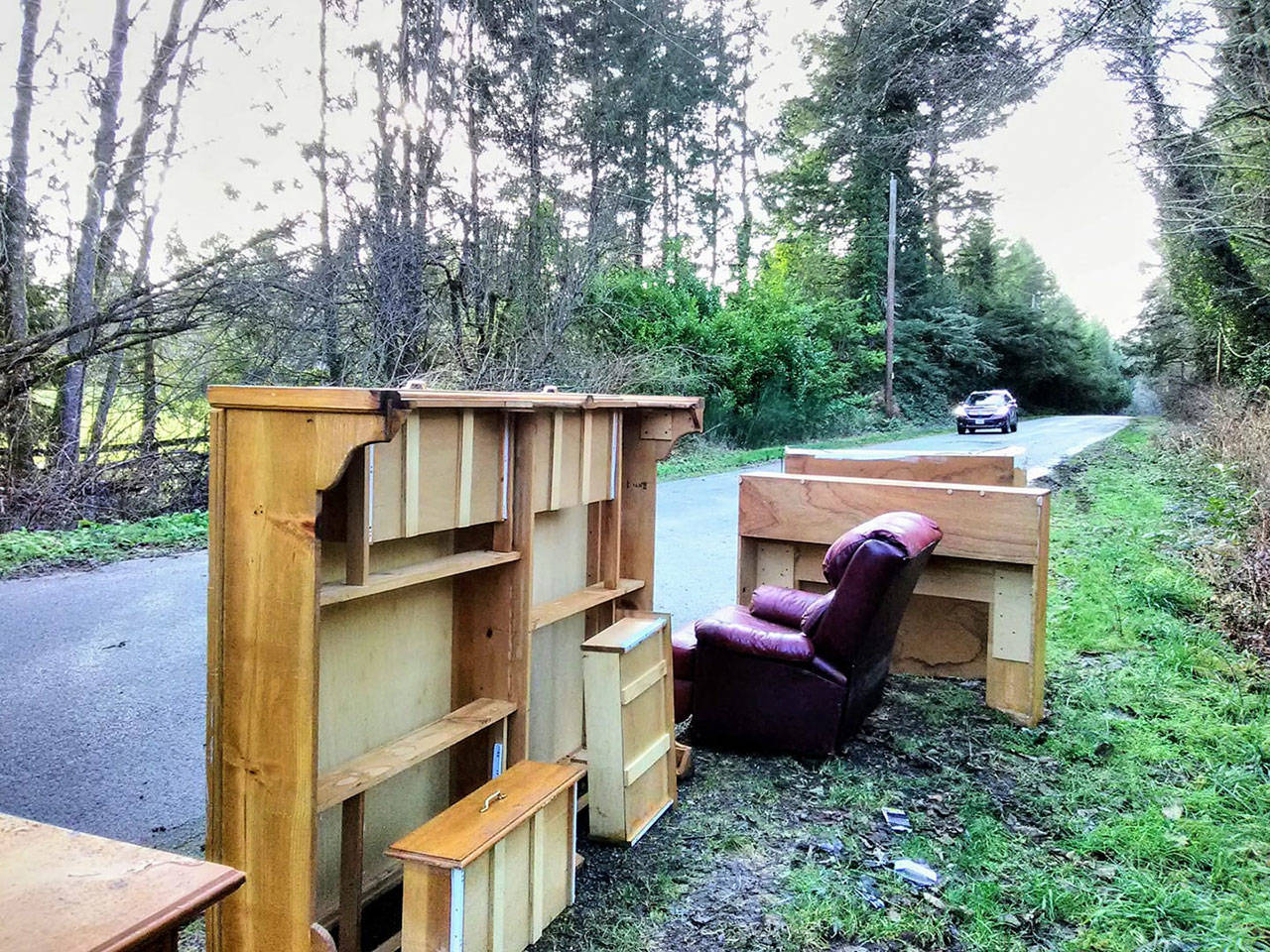 Furniture recently left on the side of Old Mill Road near Misty Isle Farms. The Vashon Park District has had to contend with a rise in illegal dumping in its properties (Paul Rowley/Staff Photo).
