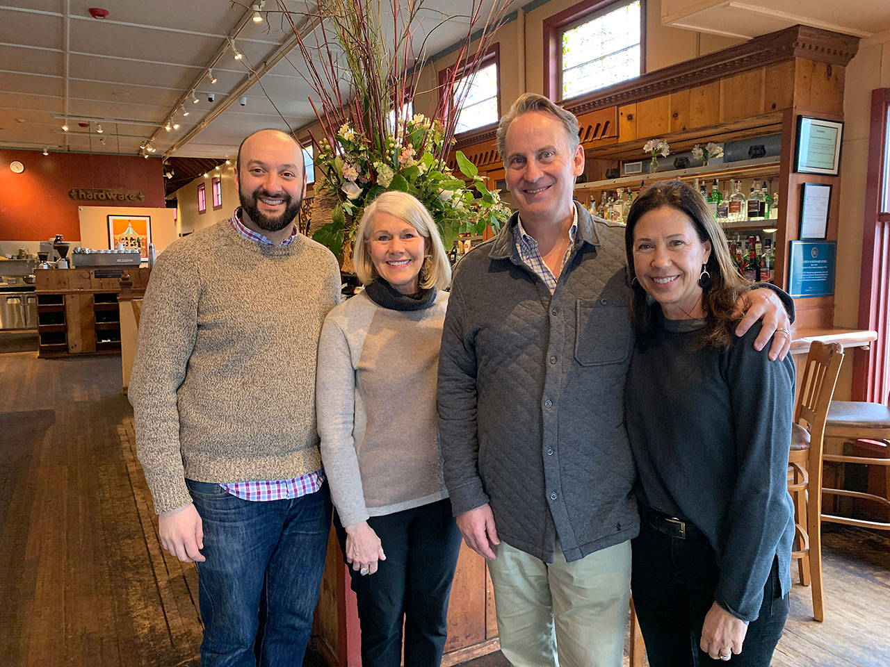(Left to right): Adam Chumas, general manager; Melinda Powers, founder, former general manager and owner; and managing partners Rob and Janie Andrews pose for a picture on Monday, Feb. 3, at the Hardware Store Restaurant. (Kevin Opsahl/Staff Photo)