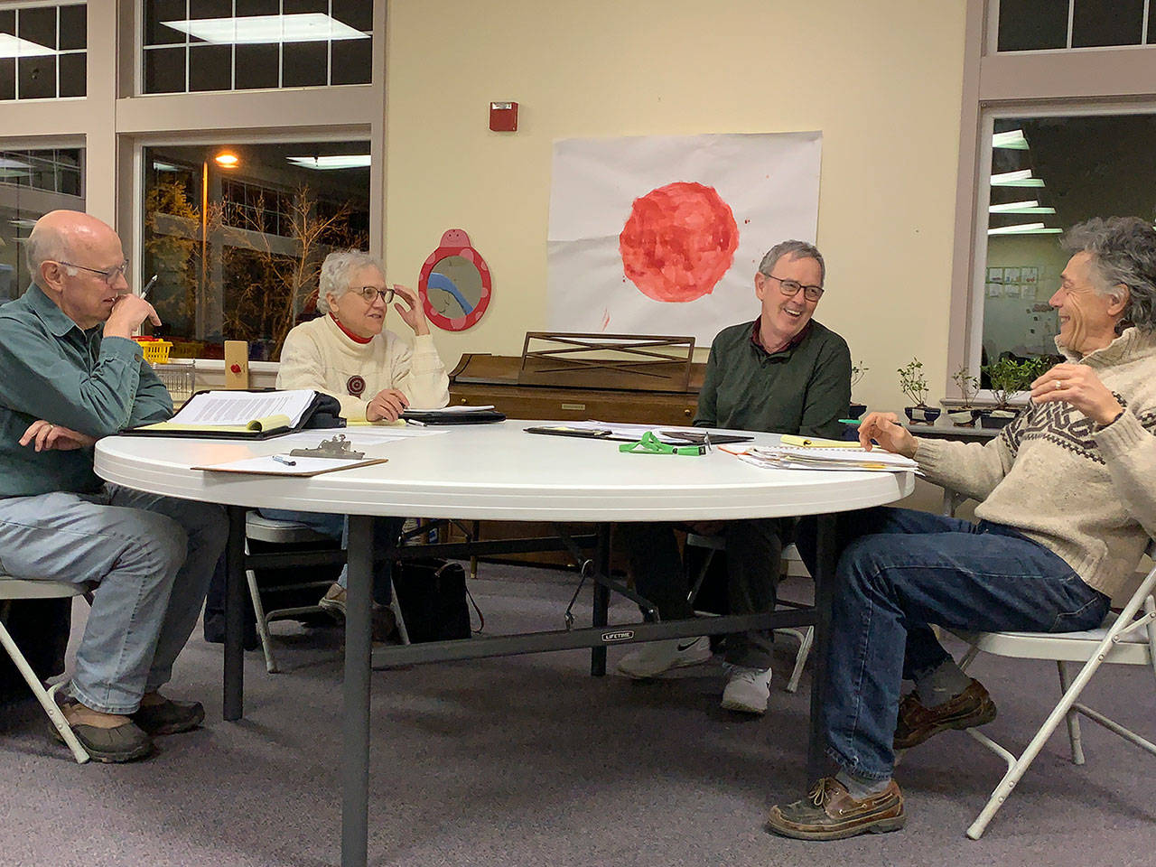 Kevin Opsahl/Staff Photo                                Health Care District board commissioners Eric Pryne, Wendy Noble, Tom Langland and Don Wolczko share a laugh before the start of a meeting on Wednesday, Feb. 12 at the Vashon Presbyterian Church.