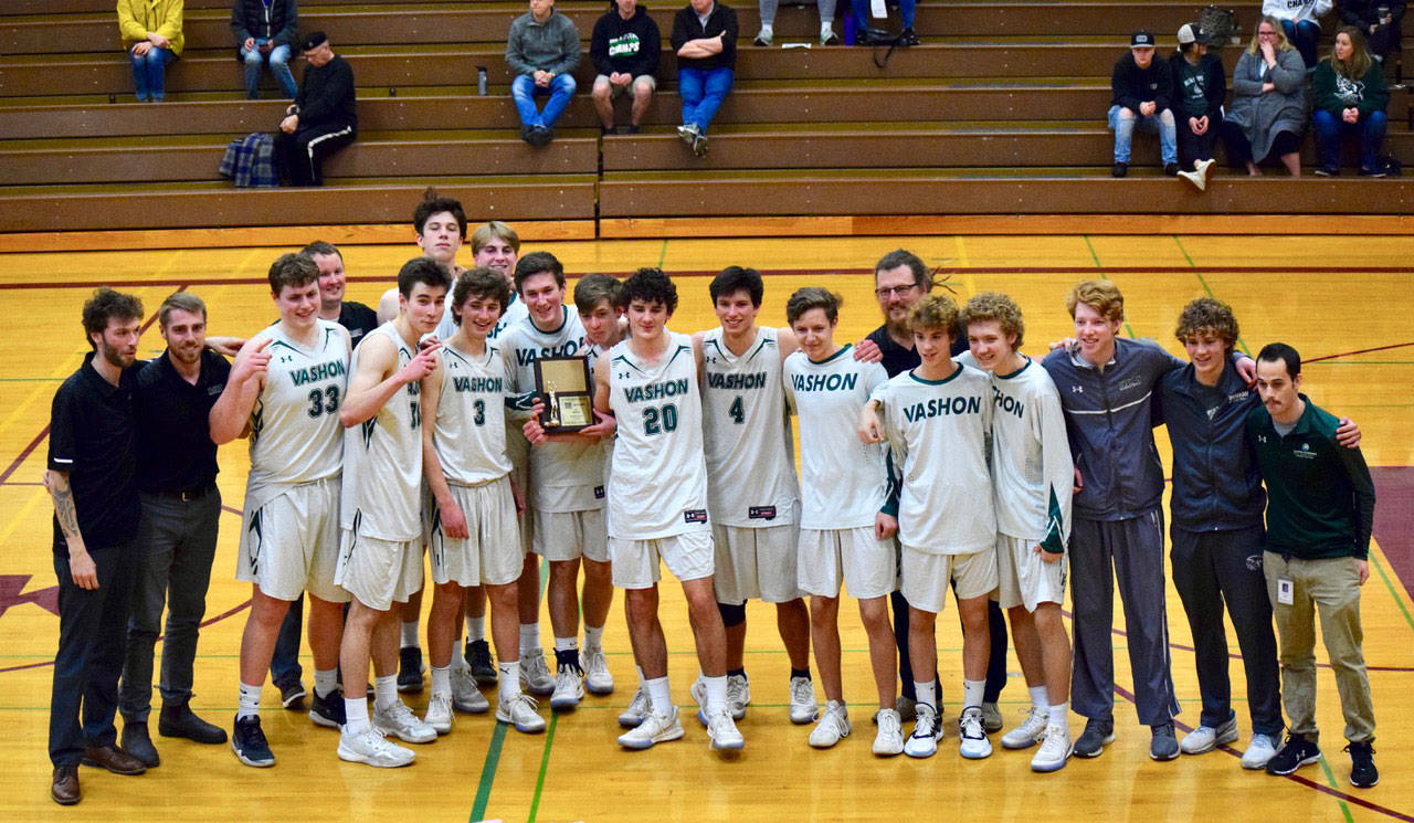 The Vashon Island High School boys basketball team pose with a plaque signifying their placement of second in 1A West Central District III boys basketball. (Pam Stenerson Photo)
