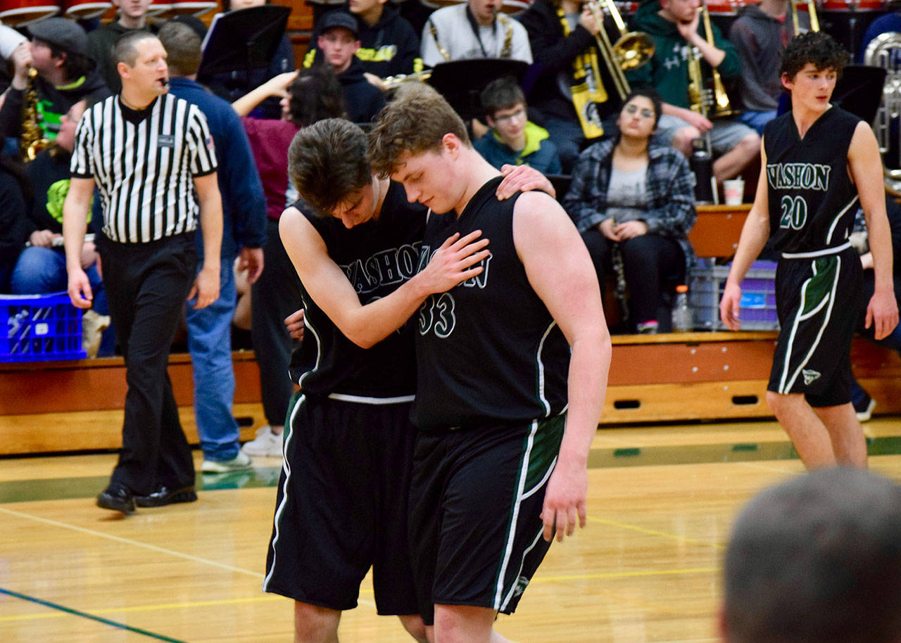 VHS boys basketball player Isaac Patchen, left, embraces Finbar Anderson seconds after the regional playoffs ended on Friday, capping the Pirates’ 2019-20 season. (Pam Stenserson Photo)