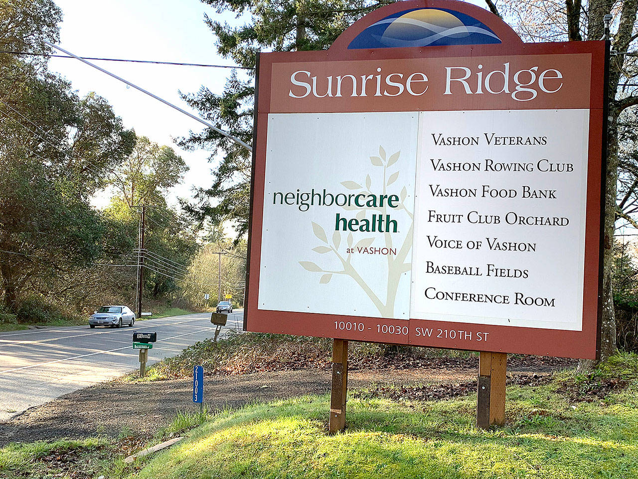 The sign for Neighborcare Health, the entrance to Sunrise Ridge, is seen along Vashon Highway in February. (Kevin Opsahl/Staff Photo)