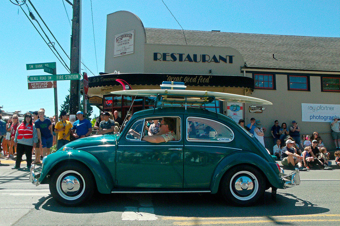 An antique Volkswagon Beetle rolls through town during last year’s Strawberry Festival (File Photo).