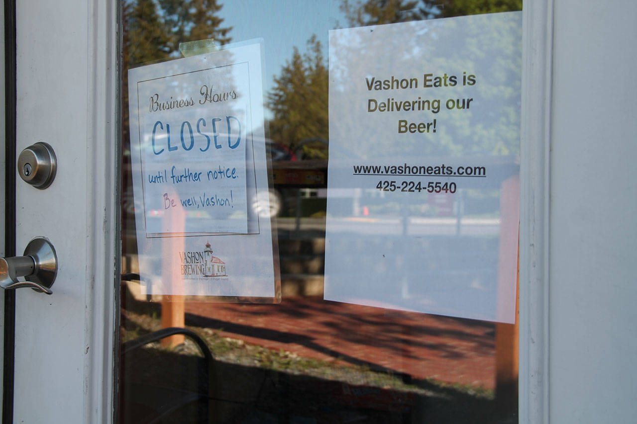 A sign posted in the window of Vashon Brewing Community Pub (Paul Rowley/Staff Photo).