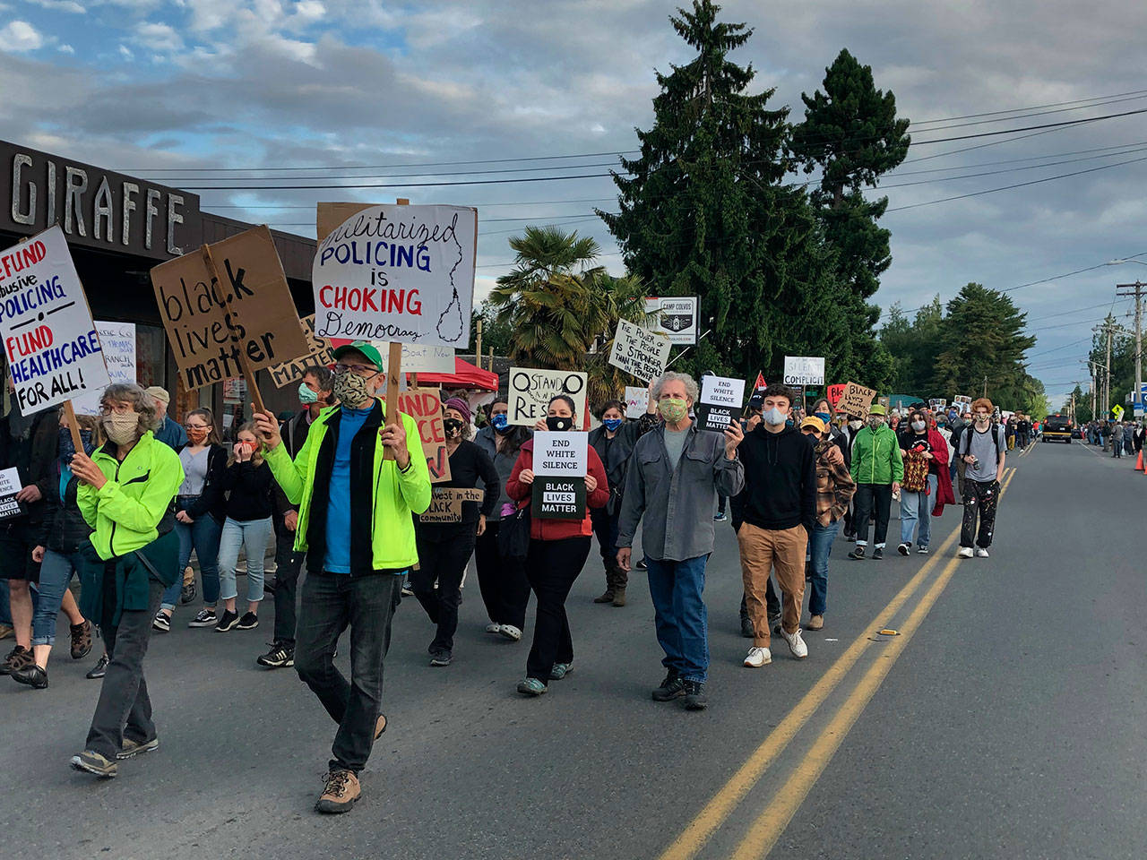 Marchers lined one side of Vashon Hwy. on Friday evening, responding to the call of Black Lives Matter Seattle-King County for silent marches and a general strike throughout Washington State (Tom Hughes Photo).