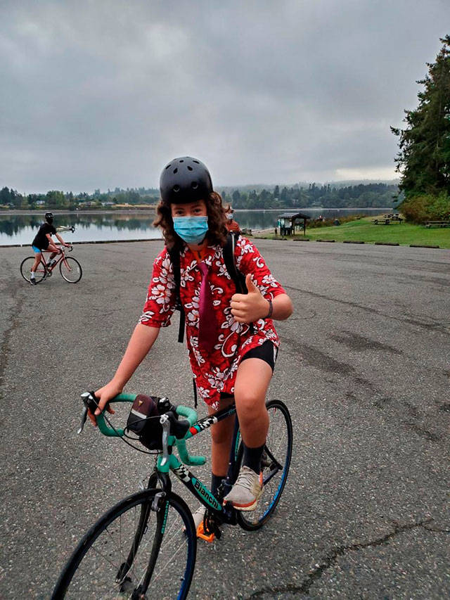 Junior rower Gus Holmes masked up for this year’s Passport2Pain biking event (Courtesy Photo).