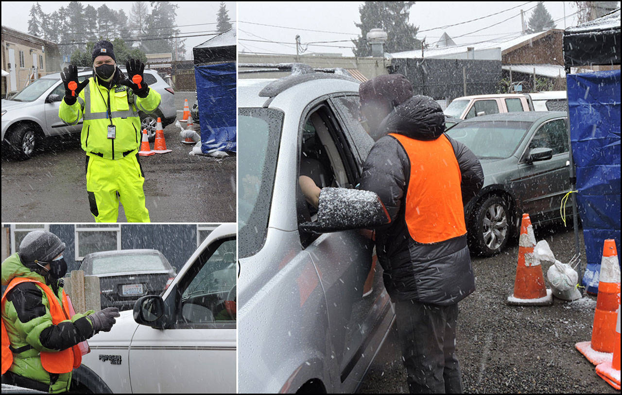 CERT and MRC volunteers and Vashon Pharmacy staff kept the vaccination site running smoothly on Friday, despite intensifying snow flurries and dropping temperatures. The site had to be closed on Saturday, due to increasing safety concerns from greater than anticipated snow accumulations (Photos by Allen de Steiguer).