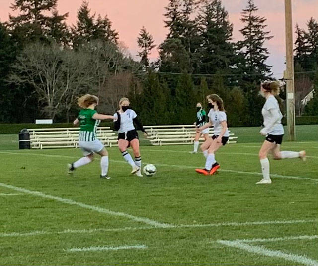 Vashon junior midfielder Franki Brown (#7) and freshman midfielder Linnea Heuschert (#5) are team members of the VHS girls’ soccer team (Phoebe Wilke Photo).
