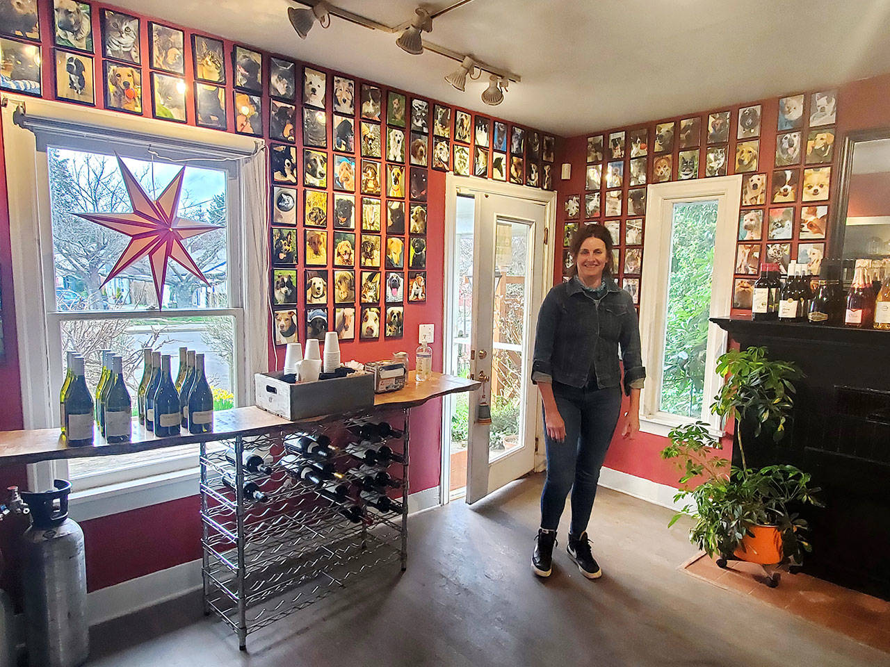 Hedy Anderson, owner and chef at Vashon’s Sugar Shack, has created a wall of portraits of islanders’ dogs (and a few cats) inside her business (Phil Clapham Photo).