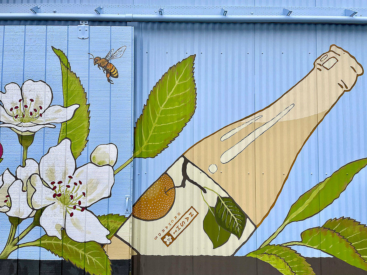 A large mural by local artist Annie Brulé, at Nashi Orchard’s tasting room (Courtesy Photo).
