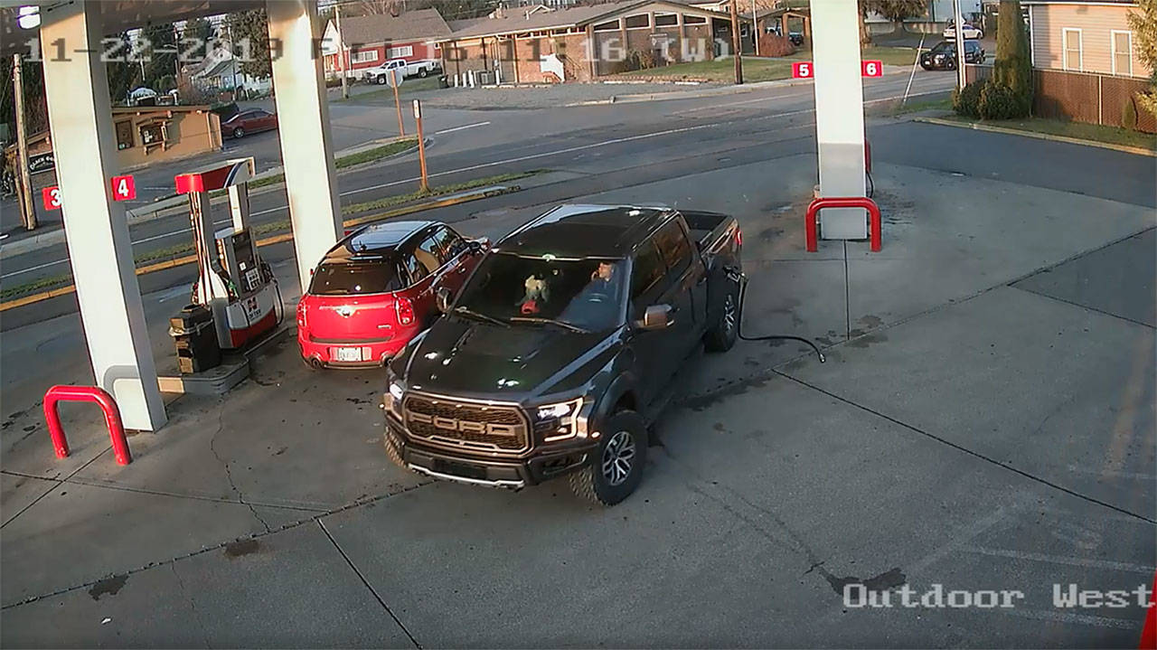 Image courtesy Cenex gas station
This security footage at the Cenex gas station in Black Diamond shows Anthony Chilcott on his phone before entering, and driving off with, Carl Sanders’ Ford Raptor and Monkey, his poodle, in the front seat.