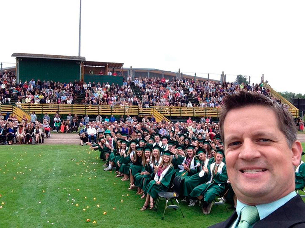 Danny Rock, principal of Vashon High School, beams for a selfie at the 2019 VHS graduation, never dreaming of the way a pandemic would disrupt education in 2020-2021. But this year, hell have another chance to return to gather with his cap-and-gowned students in a ceremony that seems closer to normal than the one that took place last year (Danny Rock Photo).