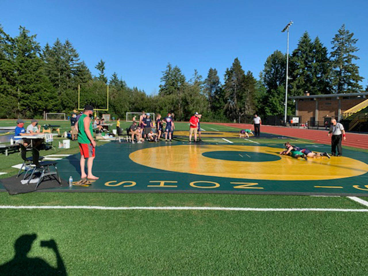 The Vashon Pirate wrestling team hosted a Triple-Dual outside on the high school football field last week (Anders Blomgren Photo).