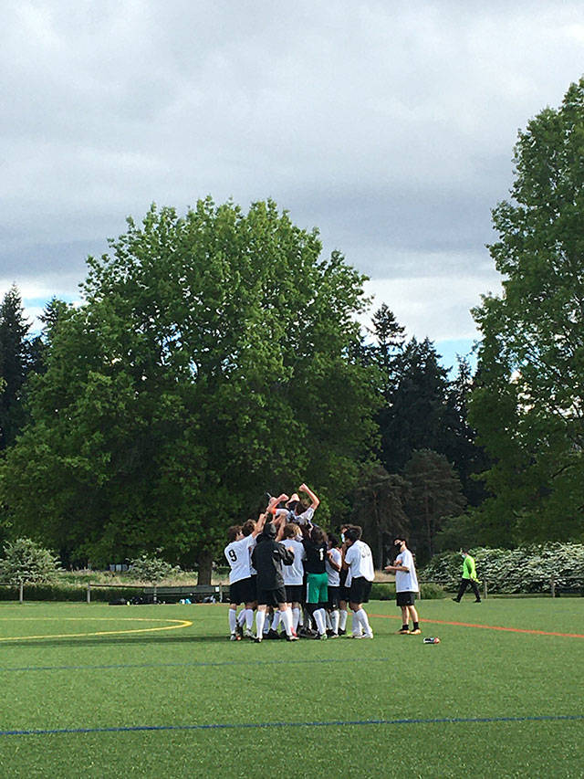 The VHS varsity boys soccer team celebrated after winning league last month (Lila Cohen Photo).