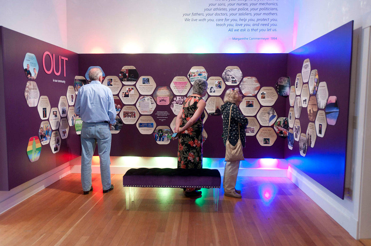 In one section of Vashon Heritage Museum’s current exhibit, “In and Out: Being LGBTQ on Vashon,” the stories of LGBTQ islanders are depicted as vignettes within cells that are part of the honeycombed beehive of the community (Courtesy Photo).