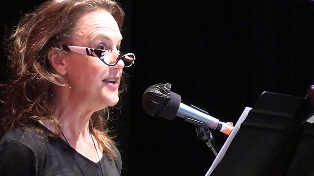 Maria Glanz records a portion of her new audio series about the life and times of Victoria C. Woodhull, which will premiere on July 4, on Voice of Vashon (Courtesy Photo).