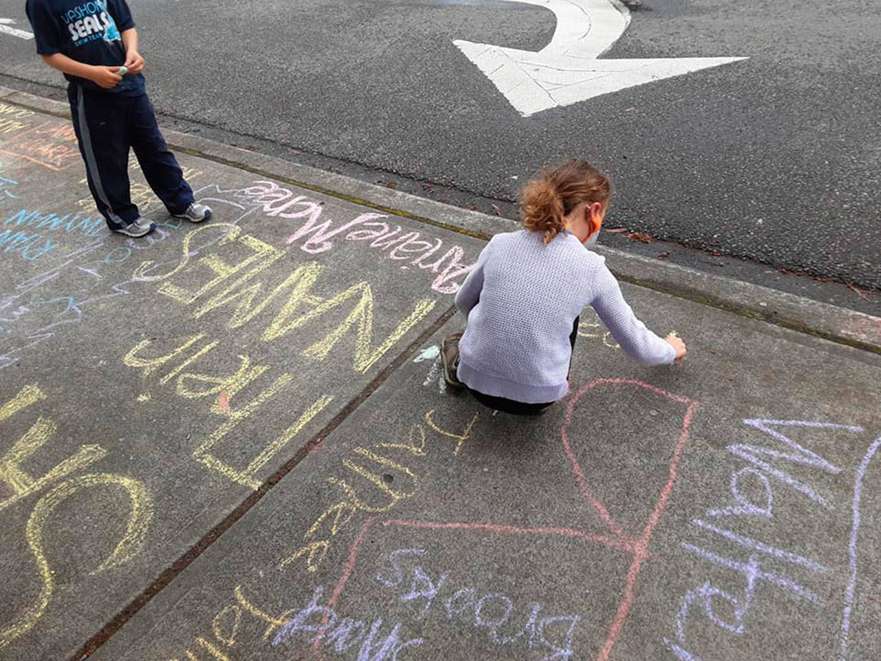 Last year’s “Chalk the Walk” event drew enthusiastic participants, despite drizzly weather (Courtesy Photo).