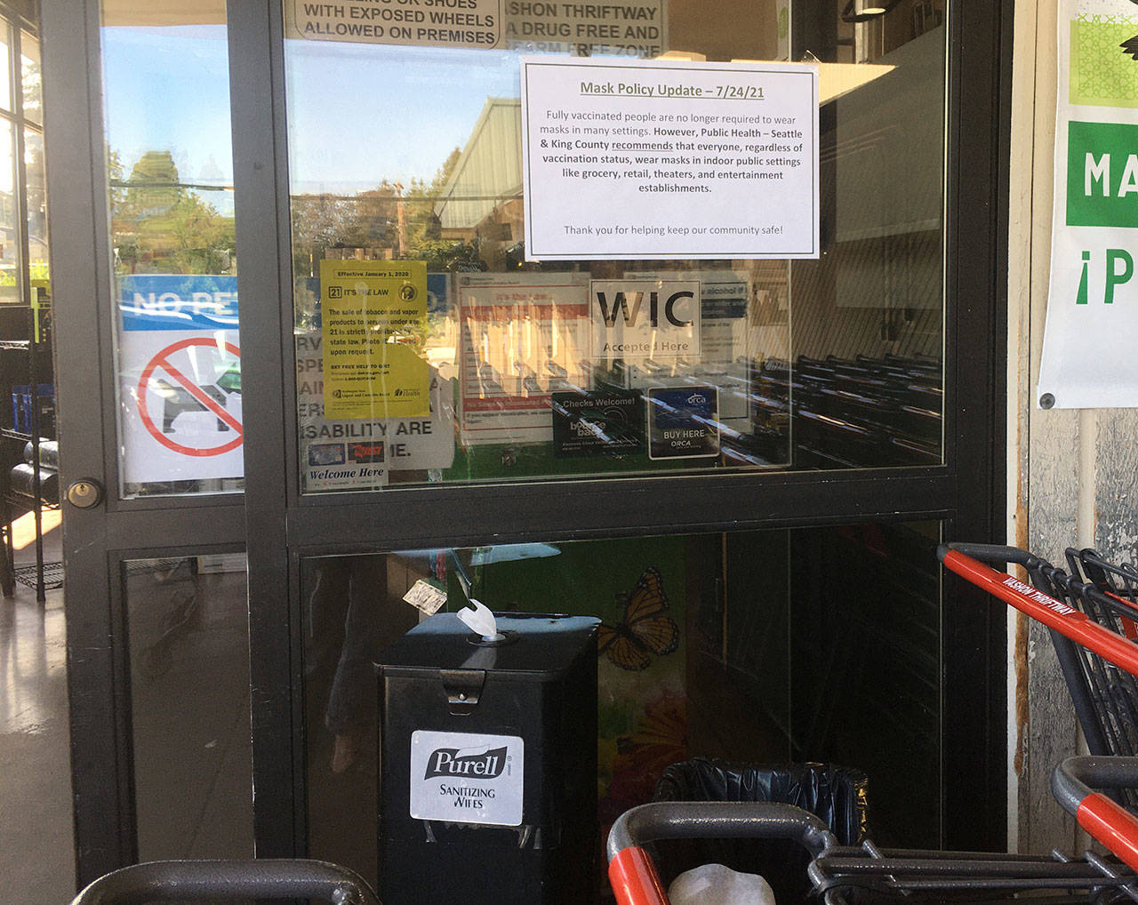On Monday, new signage appeared at Thriftway, informing shoppers of King County’s new recommendation that masks should be worn in indoor spaces by both vaccinated and unvaccinated people alike (Ellie Hughes Photo).