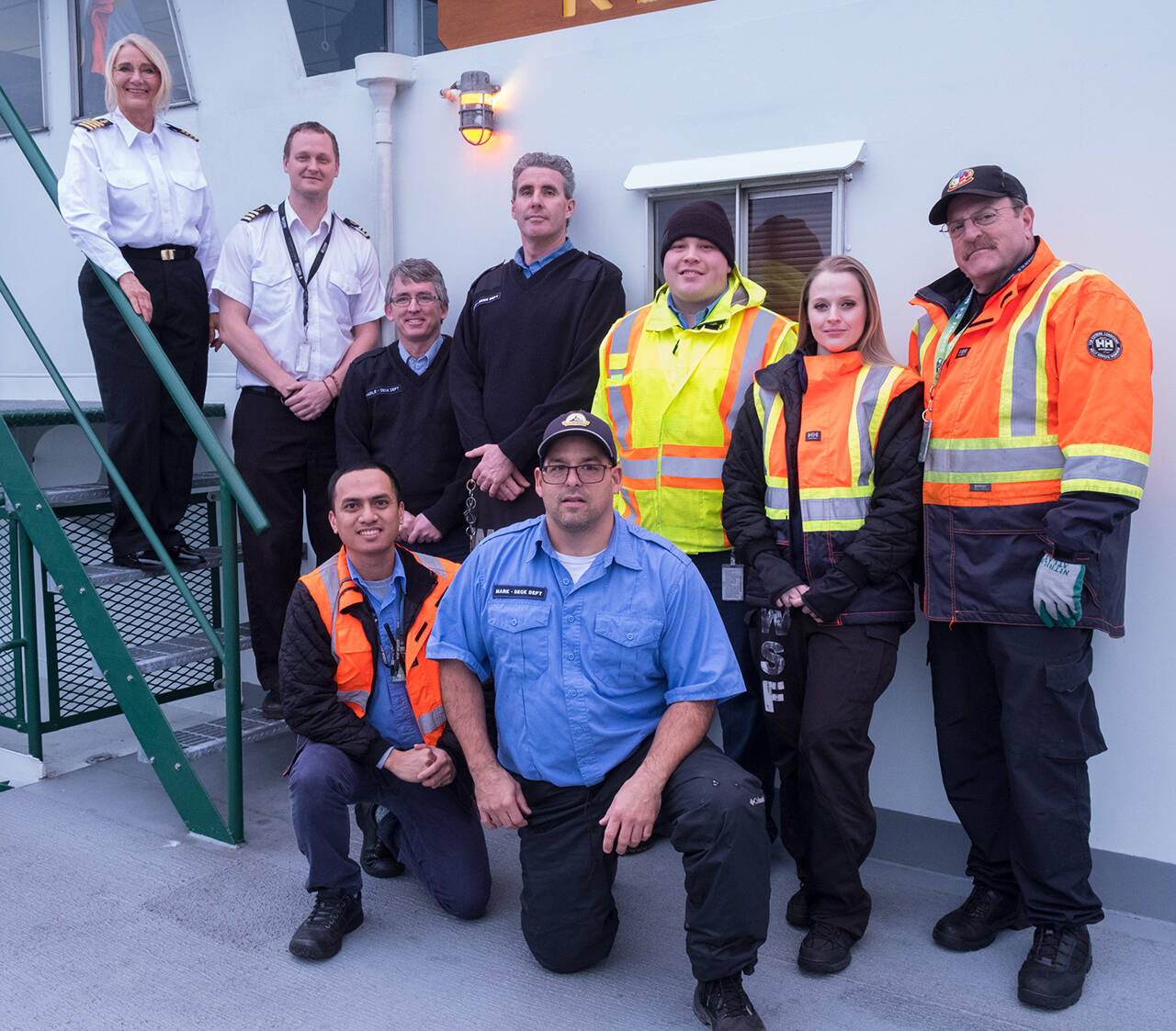 (Terry Donnelly Photo) Captain Marsha Morse, far left at the top of the stairs, and her crew, photographed aboard the MV Kitsap.