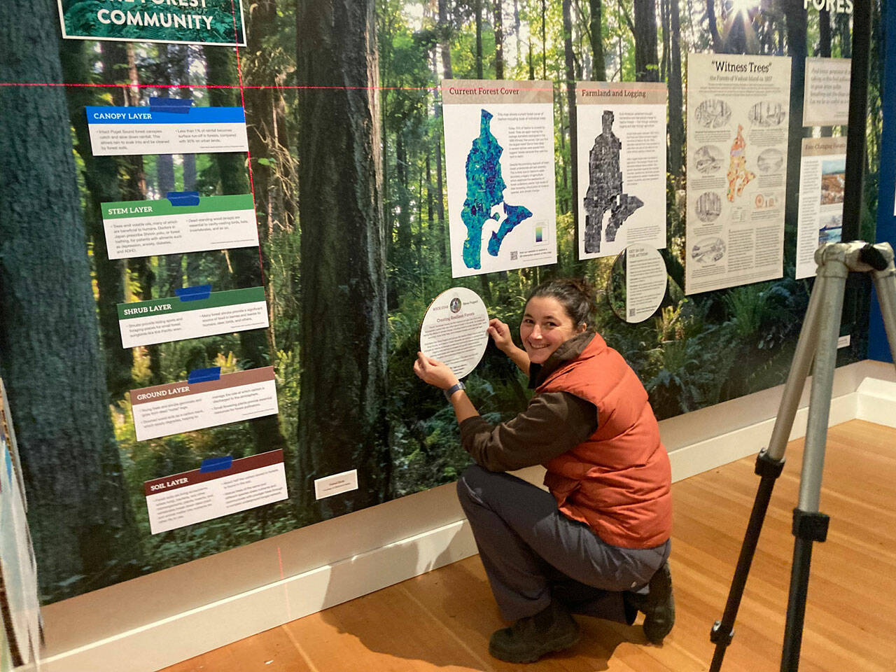 (Bianca Perla Photo) Islander Maria Metler, installing a segment of Vashon Heritage Museum exhibit “Natural Wonder: An Island Shaped by Water.” The show, created in partnership with Vashon Nature Center, opens to the public on Saturday, Nov. 6.