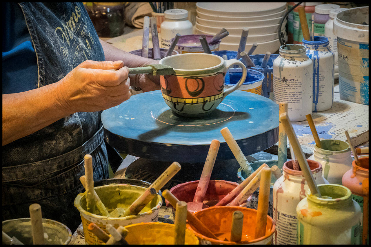 (Courtesy Photo) Liz Lewis creates colorful earthware which graces the tables of many island residents.
