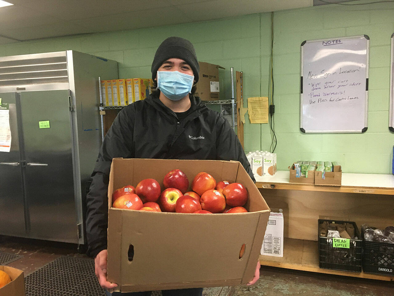 (Elizabeth Shepherd Photo) Paxtin Spencer, co-manager of the Vashon Food Bank Warehouse, at work last week.